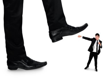 Feet man crushing little business man 