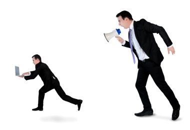 Business man screaming on megaphone
