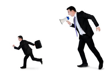 Business man screaming on megaphone
