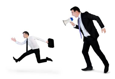 Business man screaming on megaphone