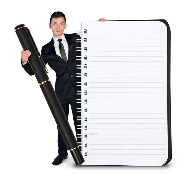 Homem de negócios com bloco de notas vazio e caneta — Fotografia de Stock