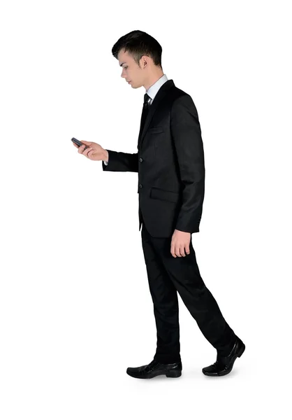 Business man walk with phone — 图库照片