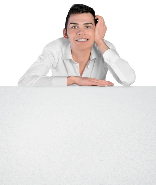 Young man leaning empty board — Stock Photo, Image