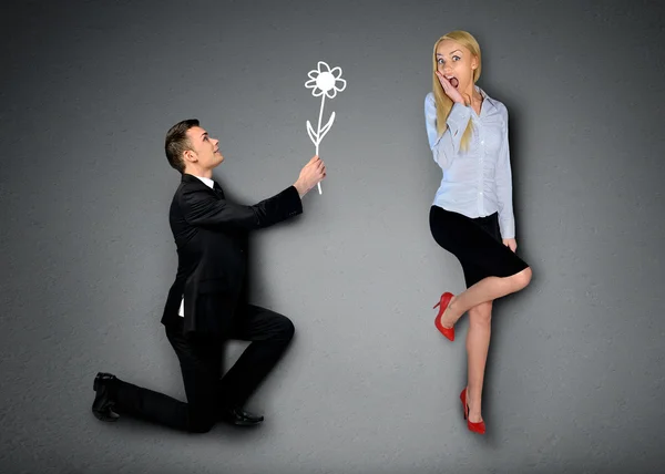 Business man giving flower — Stock fotografie