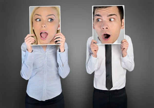 Surprised face of woman and man — Stockfoto