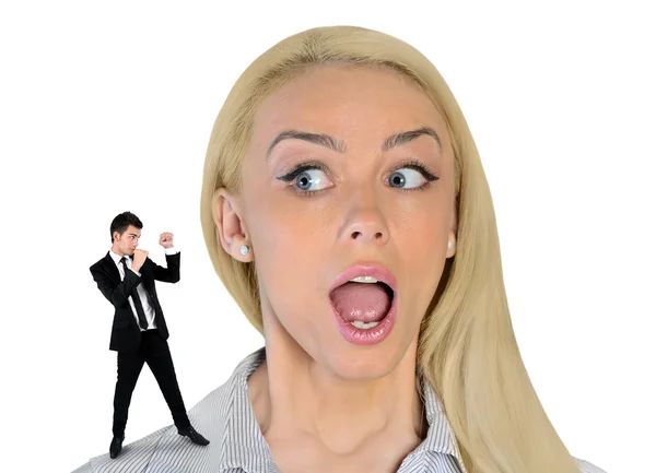 Business woman looking surprised on little man — Stockfoto