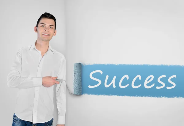Man painting Success word on wall — Stock Fotó