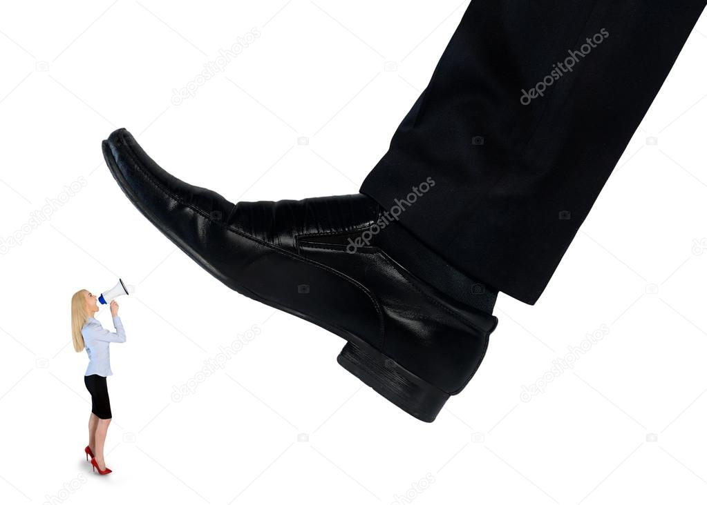 Feet man crushing little business woman