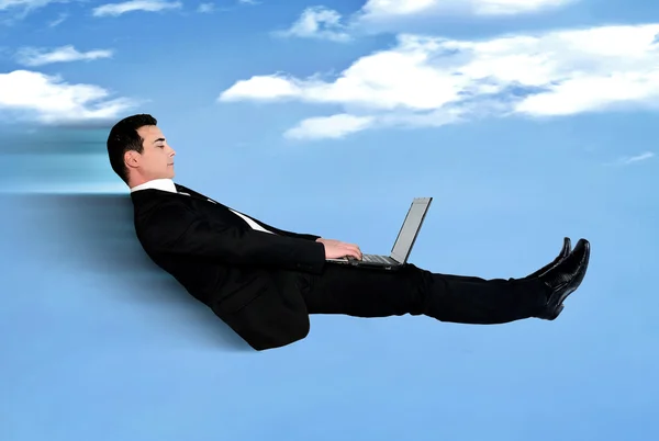 Business man fly using computer — ストック写真