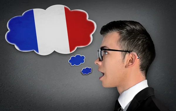 Чоловік вчить говорити французькою — стокове фото