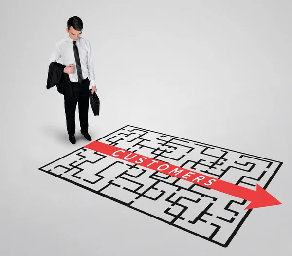 Business man thinking Customers word maze solution — Stock Photo, Image