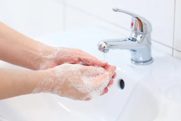 Washing of hands with soap under running water — Stock Photo, Image