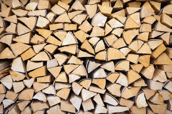 Chopped and stacked pile of wood — Stock Photo, Image