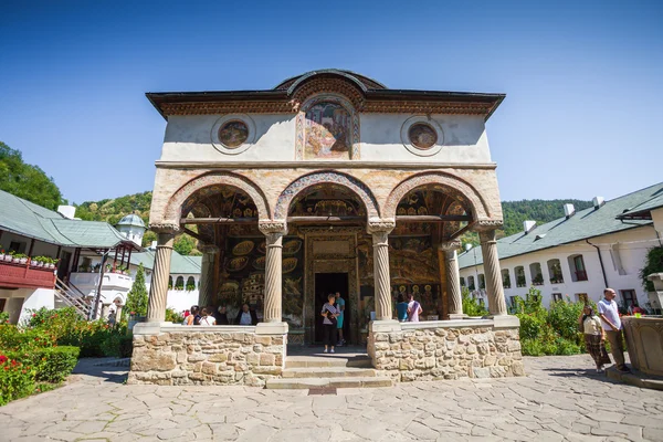 Cozia monastery church with visiting tourists — Stock Photo, Image