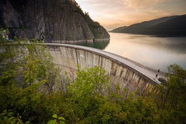 Artificial Lake behind the Bicaz Dam at sunset clipart