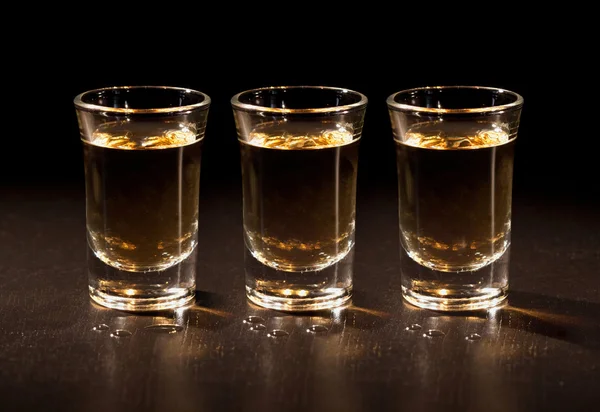 Whiskey shots in the dark — Stock Photo, Image
