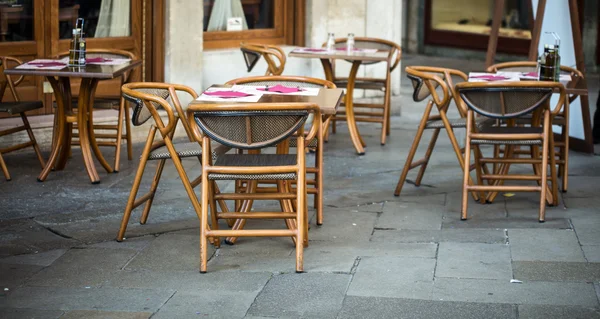 Wooden chairs of a cafe — Stok fotoğraf