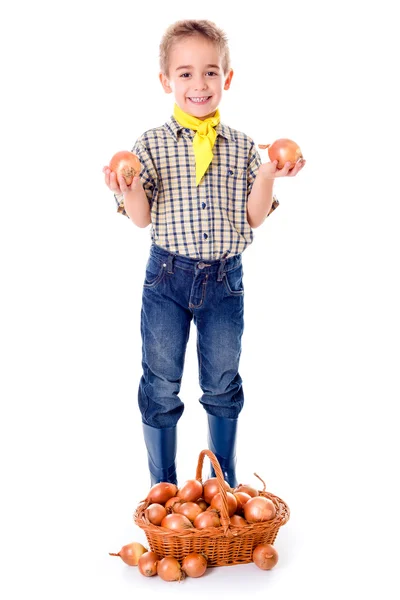 Little agriculturist holding onions — Stock Photo, Image