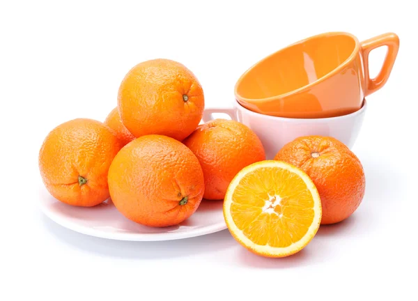 Oranges on white plate — Stock Photo, Image