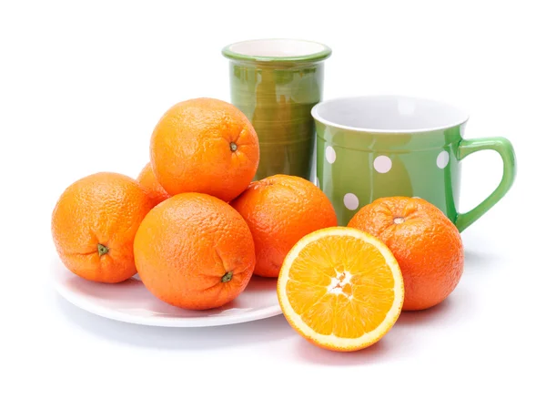 Oranges on white plate — Stock Photo, Image