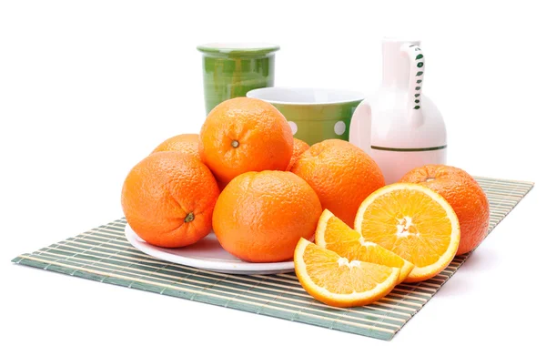 Oranges on white plate — Stock Photo, Image