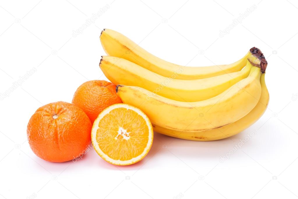 Bunch of ripe bananas and oranges