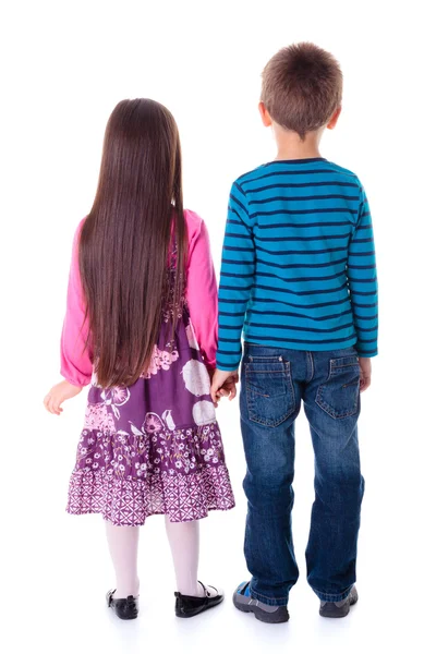 Küçük erkek ve kız ayakta ve doğru seyir — Stok fotoğraf