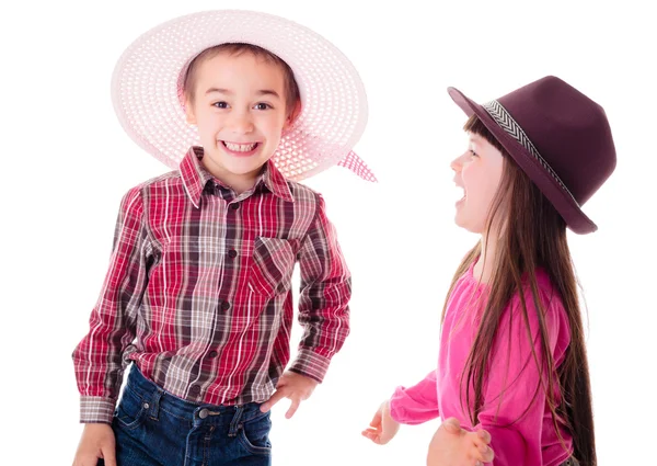 Niños felices usando sombreros opuestos —  Fotos de Stock