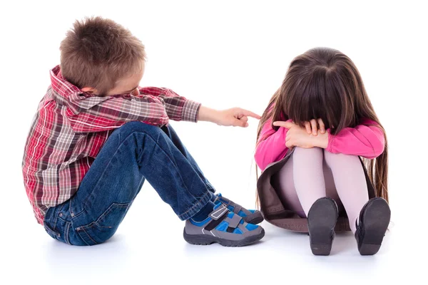 Angry sulking children pointing at each other — Stock Photo, Image