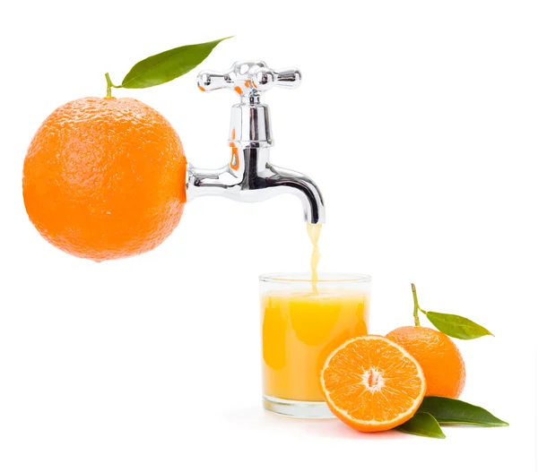 Orange juice flowing from big fruit — ストック写真