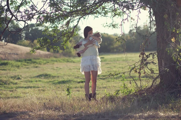 Mother and baby outdoors — Stock Photo, Image