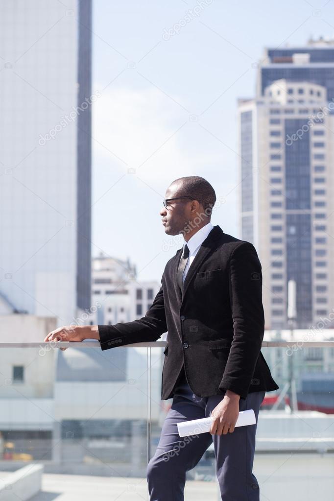 Estate agent portrait on skyscrapers background