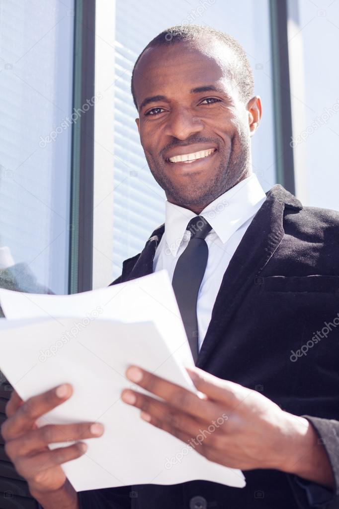 Black businessman documents handling