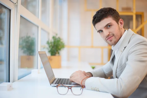 Happy worker in workplace