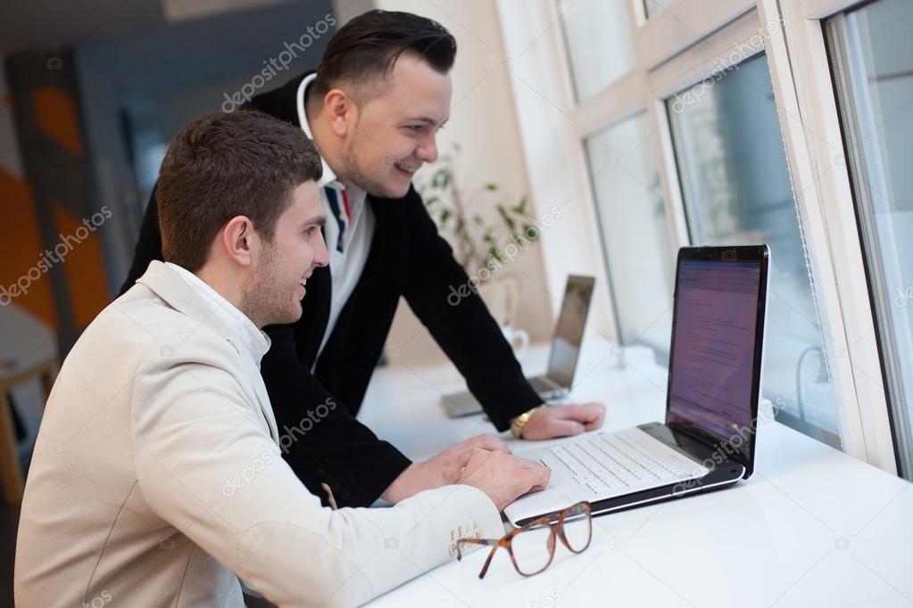 Two men working in startup center