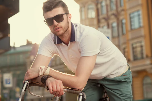 Stylish biker with vintage race bike — Stock Photo, Image