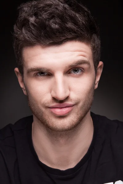 Stylish young man portrait on black background — Stock Photo, Image