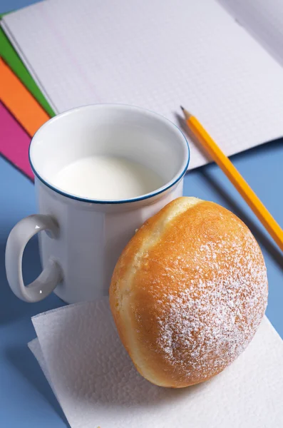 Donut with milk and notebooks — Stock Photo, Image