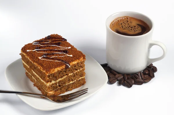 Honey cake and coffee — Stock Photo, Image