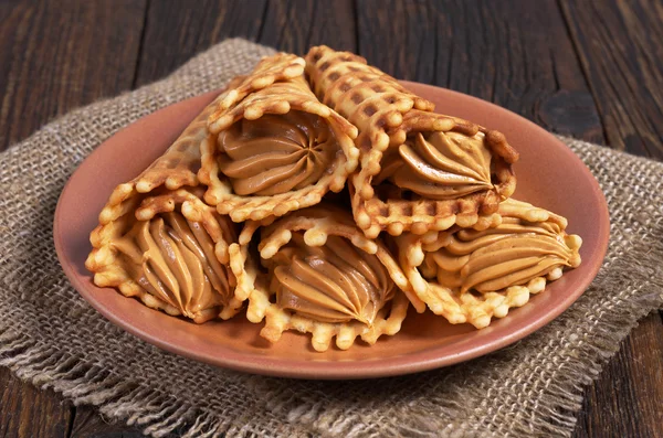Waffles cones in plate — Stock Photo, Image