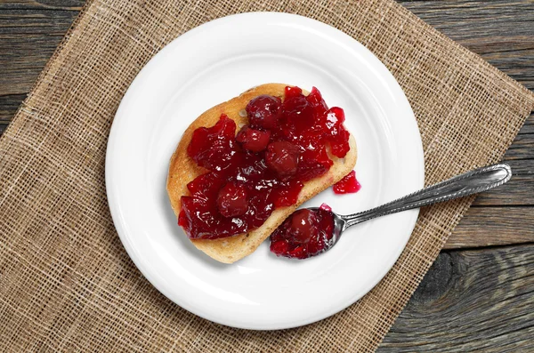 Bread with cherry jam — Stock Photo, Image