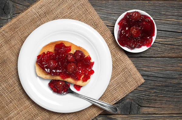 Bread with cherry jam — Stock Photo, Image