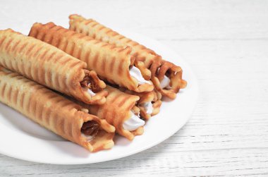 Wafer rolls with cream  clipart