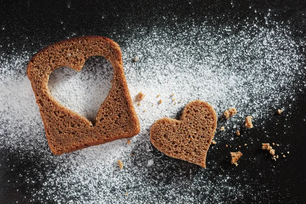 Slice Rye Bread Heart Shaped Cut Black Metal Background Top — Stock Photo, Image