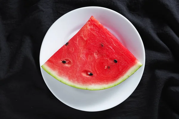 Slice Watermelon Plate Black Fabric Background Top View — Stock Photo, Image