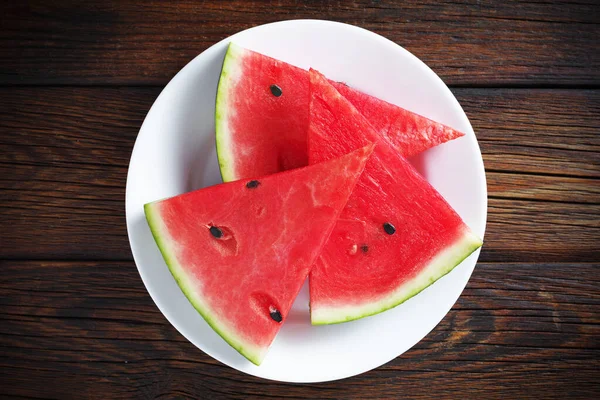 Wassermelonenscheiben Teller Auf Holzgrund Draufsicht — Stockfoto