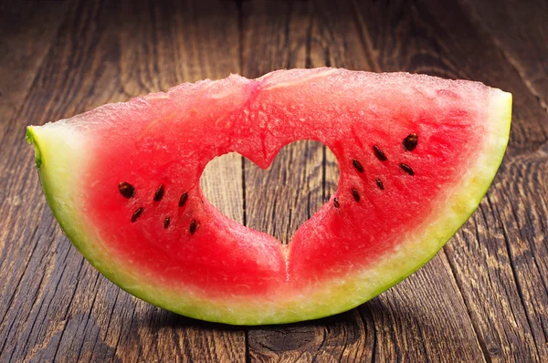 Watermelon slice with cut in the shape of heart — Stock Photo, Image