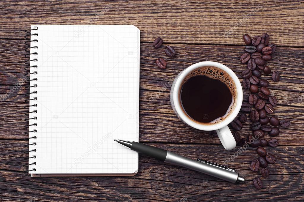 Notepad and cup of coffee