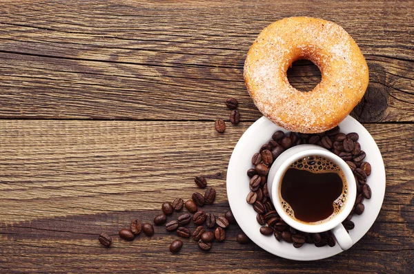 Donut med socker och kaffe — Stockfoto