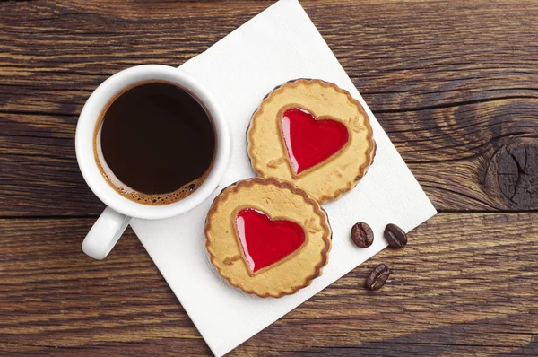 Coffee and cookies with jam in shape of heart — Stock Photo, Image